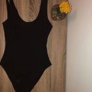 Black body suit.